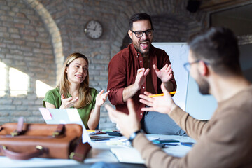 Business people discussing over new business project in office