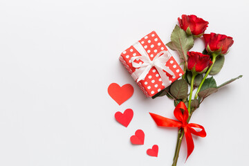 Valentine's day composition with rose flower, red heart and gift boxes on table. mother day and birthday greeting, copy space, top view