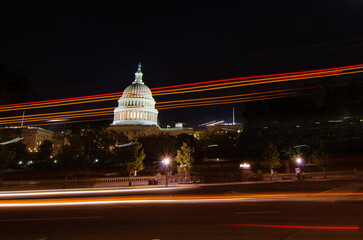 Capitol building and car light trails at night - Washington DC, United States