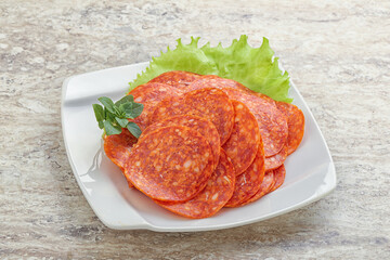 Sliced pepperoni sausage in the bowl