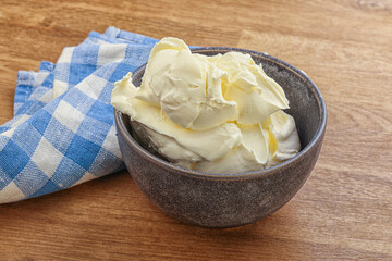 Italian soft mascarpone cheese in the bowl