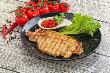 Grilled pork steak with ketchup