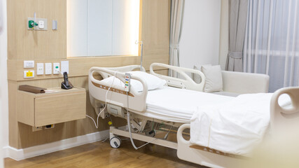 Female patient lying on an inpatient bed in the recovery room treating the illness and being closely monitored by a physician, Modern Adjustable Patient Bed in Hospital, Service point in a hospital