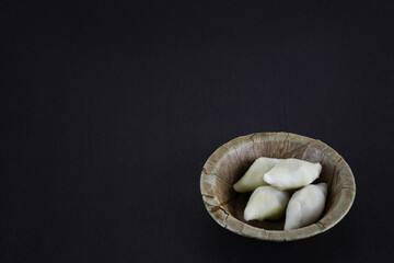 makar sangkranti or poush sangkranti celebration with puli pithe or bengali rice flour dumplings...