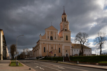 Naklejka premium The Church of the Finding of the Holy Cross (an active Catholic church) and the Bernardine Monastery on a sunny day, Grodno, Belarus