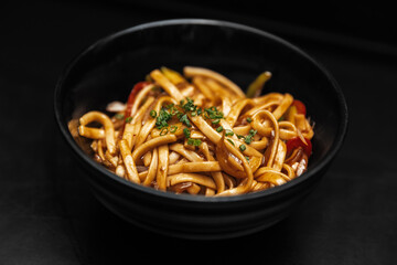 chinese noodles on a black background