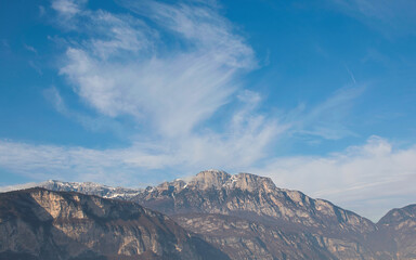 Fototapeta na wymiar Clouds in the sky above the mountains of the Trentino area, Italy.