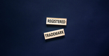Registered trademark symbol. Concept word Registered trademark on wooden blocks. Beautiful black table black background. Business and registered trademark concept. Copy space.