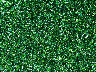 Dark green glitter. Perfect holographic background or pattern of sparkling shiny glitter for decoration and design of Christmas, New Year, Patrick Day, xmas gift card, 3d or other holiday pictures.