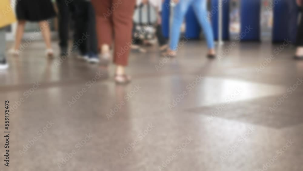 Canvas Prints defocused blurred low angle view to feet with crowd of people moving travel on the transition to the