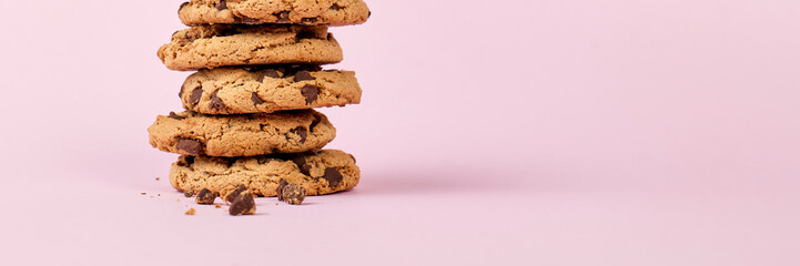 Pile of cookies close up, panoramic view, with copy space