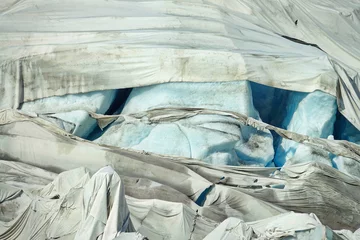 Foto auf Acrylglas The melting of the Rhone Glacier is the most visible sign of climate change. Due to high temperatures, white sheets can no longer protect the glacier from melting. © Mike Dot