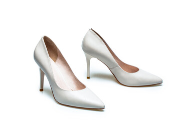 White high heel women shoes on white background. White shoe for women. Beauty and fashion concept. Fashionable women shoes isolated on white background. Stylish classic women leather shoe
