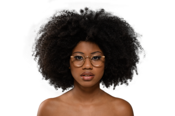 black woman wearing gold-framed glasses looking at the camera