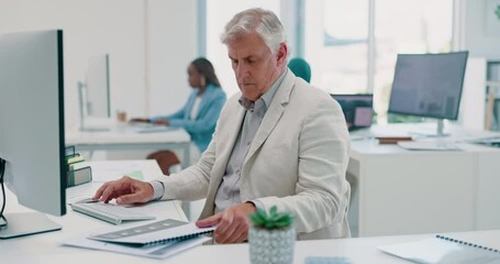Business man, computer and documents while working in a office for data analysis while typing online doing research. Senior entrepreneur at his desk with a file for information on a finance report - Powered by Adobe