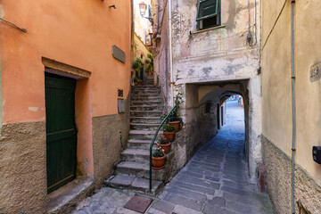 Fototapeta premium Colorful apartment homes in touristic town, Riomaggiore, Italy. Cinque Terre National Park