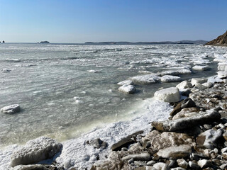 Blocks of ice off the coast of Patroclus (Patrokl) Bay at the end of winter. Russia, Vladivostok city