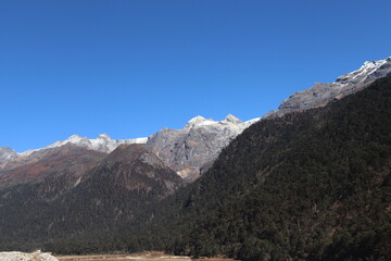 The view of mountain, ice, blue sky, water, cloudy, cool weather are the China-India border zero point in, North Sikkim. Location Zero Point, Yumthang, Sikkim.