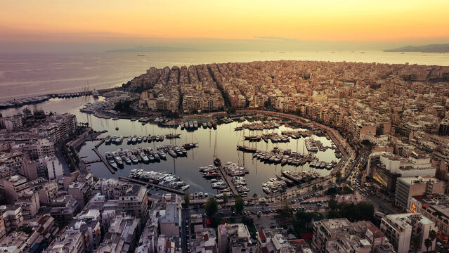 Aerial drone photo of iconic round port and Marina of Zea or Passalimani at dusk with beautiful colours, Piraeus, Attica, Greece