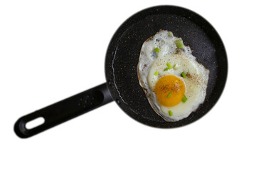 Fried egg in a frying pan isolated on white background