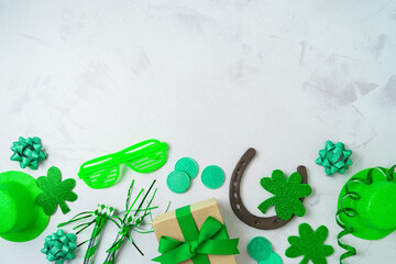 St Patrick's day holiday background with lucky charms, shamrock and party decorations. Top view,...