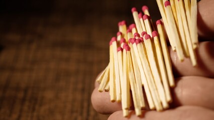 Matches are falling from your hands. Matches from the box on the arm. Close-up