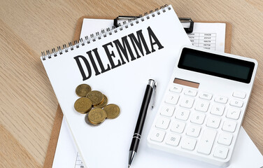 DILEMMA text on a notebook with chart and calculator and coins, business concept