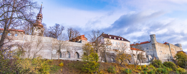 Fototapeta na wymiar Cityscape with city wall surrounding the old medieval town of Tallinn in Estonia Unesco world heritage site