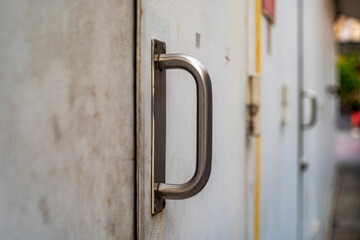 steel handle and key with steel door in the city
