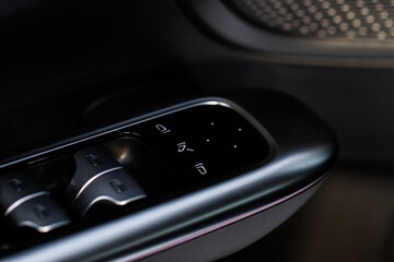 Naklejka premium Side mirrors control panel on side door.
