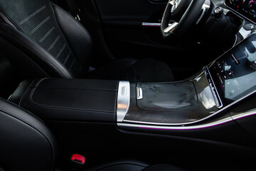 Obraz na płótnie Canvas Armrest in the car for driver. Car armrest