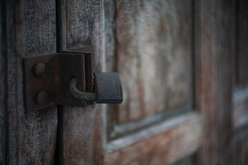Close up old lock on the door.