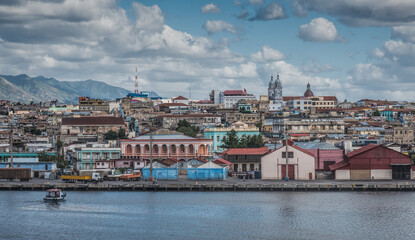 Fototapeta na wymiar Santiago de Cuba shoreline view from cruise ship leaving the bay