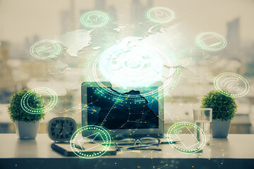 Computer on desktop with social network hologram. Double exposure. Concept of international people connections.