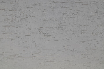 Surface puttied with decorative putty as a background. Preparation of facade walls