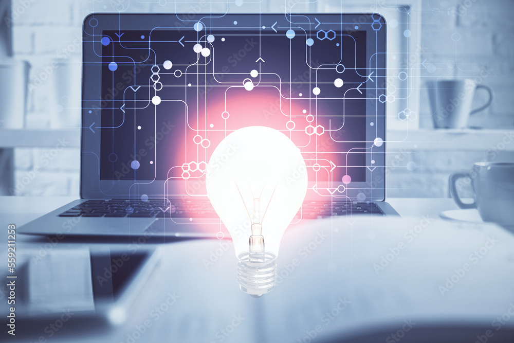 Poster Computer on desktop in office with bulb icon hologram. Multi exposure. Concept of idea.