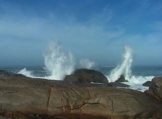 wave crashing over rocks
