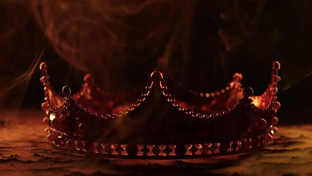 Fabulous golden crown of the king on a dark background. Panoramic view of the blue and red fog. Mockup for your logo. 