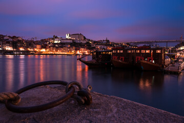 view of the old town (cais do ribeira)  by night . summer. porto. portutal. - 559213490