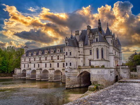 Beautiful Chateau de Chenonceau at dusk over the river Cher, Loire Valley, France.