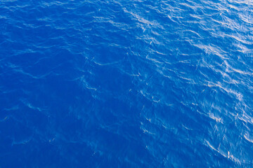 Very nice sea water background or backdrop with selective focus. Small waves of natural water surface texture.