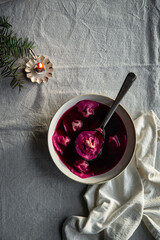 Bowl of traditional Ukrainian Christmas dish - borsch with vushka (porcini dumplings) prepared for Christmas Eve supper. 