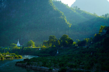 River and Pagoda in misty landscape, Moei River, Tha song yang District, Tak Province, Thailand.