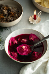 Bowl of traditional Ukrainian Christmas dish - borsch with vushka (porcini dumplings) prepared for Christmas Eve supper. 