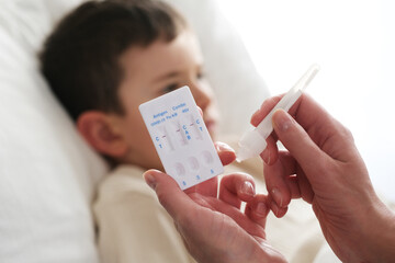 A little boy is sick, a combo antigen test (covid-19, flu a b, RSV) is needed for proper diagnosis.