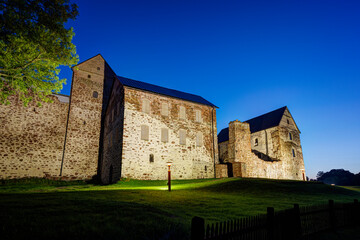 Lit medieval Kastelholm Castle in Åland Islands, Finland, at dusk in the summer.