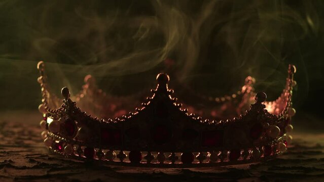 Fabulous golden crown of the king on a dark background. Panoramic view of the fog. Mockup for your logo.