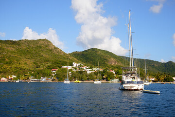 Fototapeta na wymiar yachts at anchorage, caribbean sea, turquoise water, snow-white yachts in Martinique