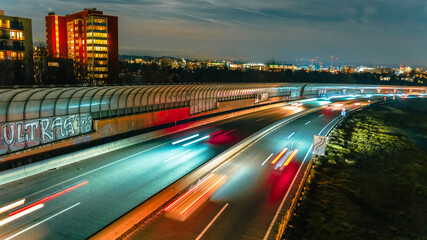 light trails of traffic on the highway at night