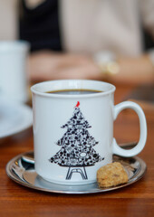 a cup of coffee and cookies